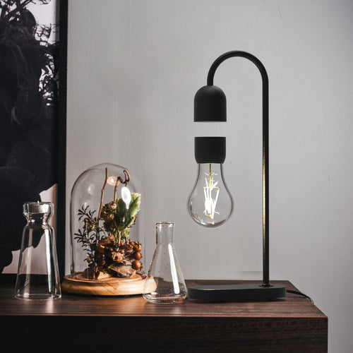 Luksuriøs bordlampe, der kombinerer moderne design med innovative svæve funktion.